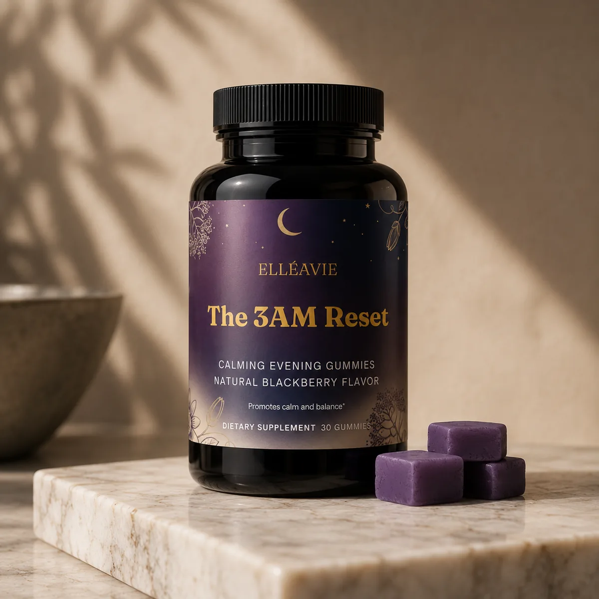 The 3AM Reset by Elléavie — a jar of calming evening gummies with blackberry gummies on a marble surface.